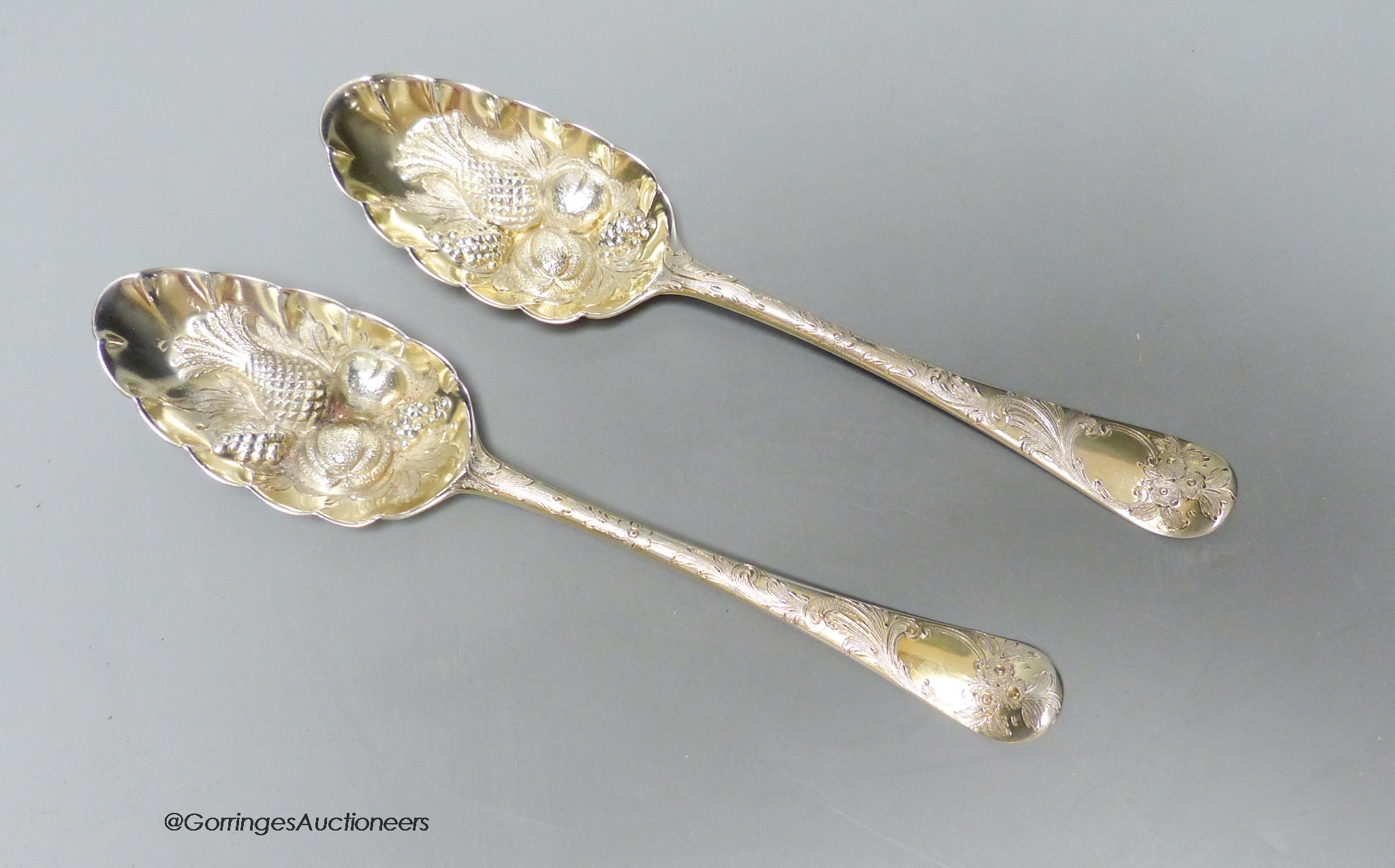 A pair of 18th century silver 'berry' spoons by Ebenezer Coker (marks rubbed and pinched), 19.8cm, 126 grams.